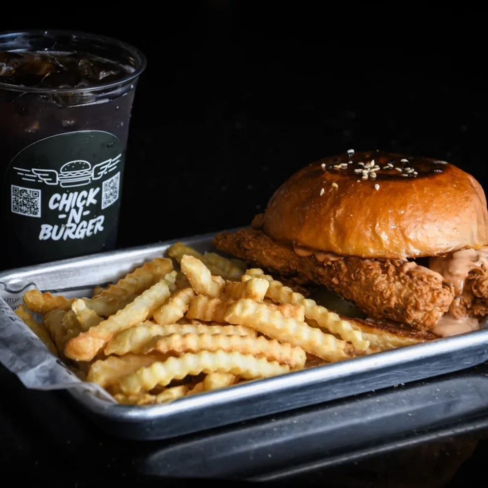 Chick N Burger meal with a fried chicken sandwich, crinkle-cut fries, and a soda.